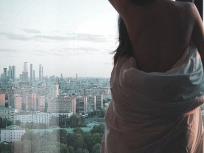 View from a window showing a calm morning sky.